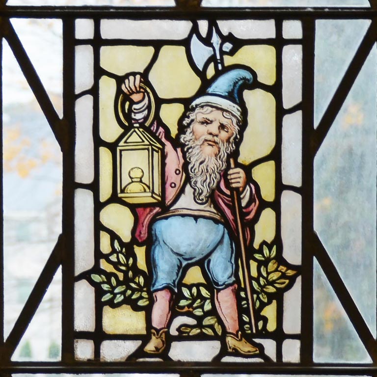 Stain glass rendering of gnome holding a lantern